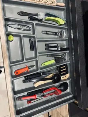 a drawer full of knives and other kitchen utensils at David in La Tour-du-Crieu