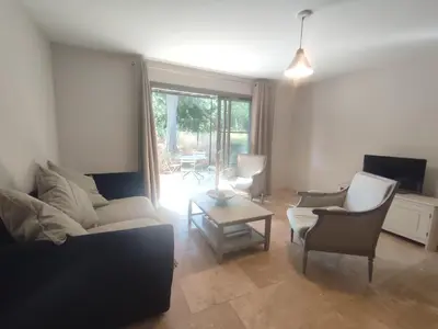 a living room with a couch and chairs and a table at Villa Élegancia - Piscine privé - Wifi - 18 in La Redorte
