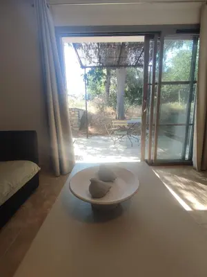 a room with a plate on a table in front of a door at Villa Élegancia - Piscine privé - Wifi - 18 in La Redorte