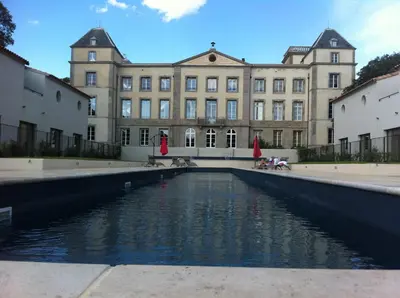 a large building with a pool of water in front of it at Villa Élegancia - Piscine privé - Wifi - 18 in La Redorte