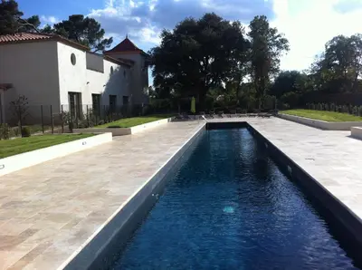 a swimming pool in front of a building with a house at Villa Élegancia - Piscine privé - Wifi - 18 in La Redorte