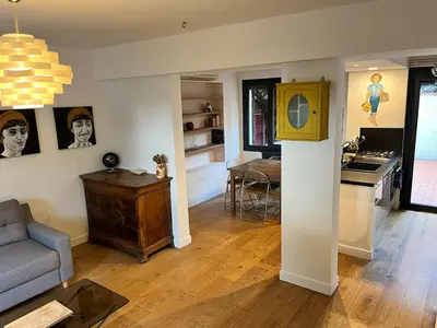 a living room with a couch and a table at Artistic house in Carcassonne