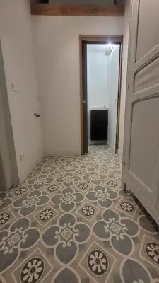 an empty hallway with a tile floor and a door at Peyriac de Mer House in Peyriac-de-Mer