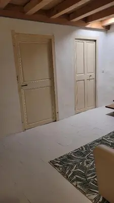 an empty room with a door and a rug at Peyriac de Mer House in Peyriac-de-Mer