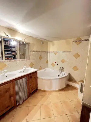 a bathroom with a tub and a sink at Maison de village pleine de charme, 7 couchages in Vingrau