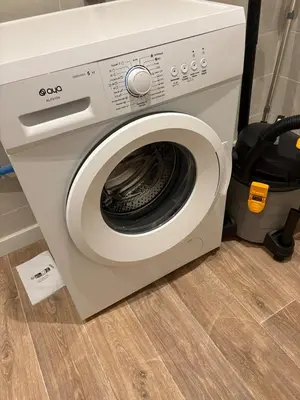 a washing machine with its door open on a floor at Albert I Ground floor l Terrace l Garden l Air conditioning in Castres