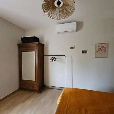 a room with a refrigerator and a fan at Domaine VILLECARLA, Gîte 2 Canal du Midi Carcassonne in Villedubert