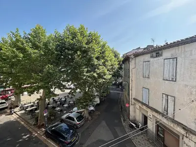 an overhead view of a street with cars parked next to a building at Tout Le Monde in Quillan
