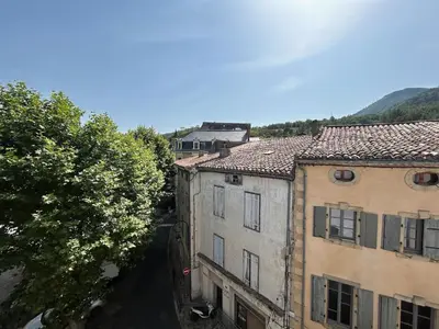 an overhead view of two buildings in a city at Tout Le Monde in Quillan