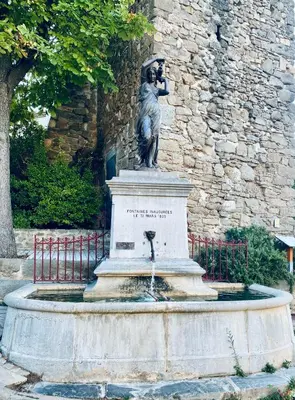 a statue of a woman sitting on top of a fountain at Le Bastion, 15 guests, 5 suites, 5 baths, AC in Pouzols-Minervois