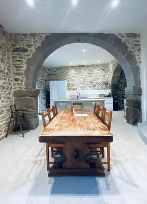 a kitchen with a wooden table and a sink at Le Bastion, 15 guests, 5 suites, 5 baths, AC in Pouzols-Minervois
