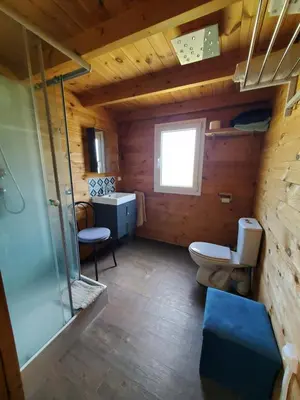a bathroom with a toilet and a sink at Le Chalet du Grain d'Orient in Caudiès-de-Fenouillèdes