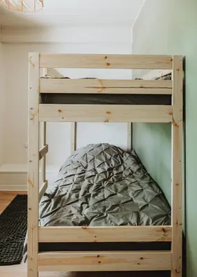 a wooden bunk bed in a room with a pillow at Gîte - Holiday Home Vent Cers in Limoux