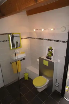 a bathroom with a toilet and a sink and a tub at Havre de paix avec piscine et jacuzzi Narbonne in Ventenac en Minervois