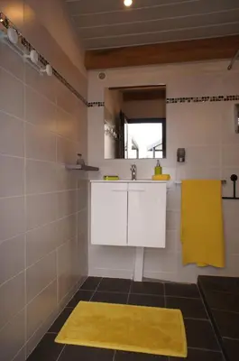a bathroom with a sink and a mirror at Havre de paix avec piscine et jacuzzi Narbonne in Ventenac en Minervois