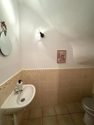 a bathroom with a sink and a toilet at L'Estaple in Berlou