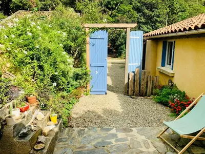a swimming pool in a backyard with a pergola at Peaceful Gite By The Black Mountain in Caunes-Minervois