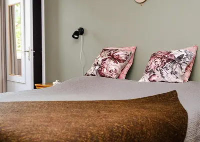 a bedroom with a bed with two pillows at Chambre d'Hôtes - B&B La Moneze Basse in Limoux