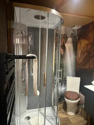a bathroom with a shower and a toilet at Studio repaire des pirates du Cloitre in Narbonne