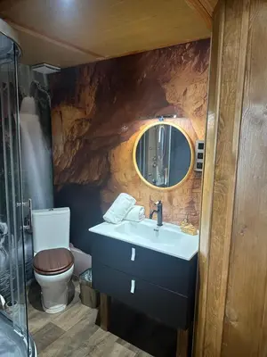 a bathroom with a sink and a toilet at Studio repaire des pirates du Cloitre in Narbonne