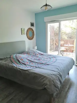 a bedroom with a bed with a blanket on it at Maison dans les Corbières in Montséret