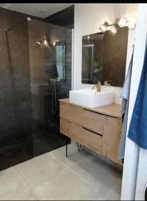 a bathroom with a sink and a shower at Maison dans les Corbières in Montséret