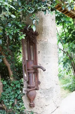 an old water hydrant on the side of a wall at Villa MAGRI 3 bedrooms in Cuxac-dʼAude