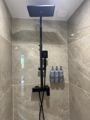a shower with a solar light in a bathroom at Domaine Rams in Villegailhenc
