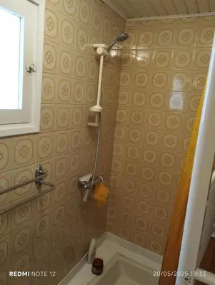 a bathroom with a shower and a sink at Petit Soleil in Quillan