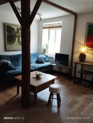 a living room with a couch and a coffee table at Petit Soleil in Quillan