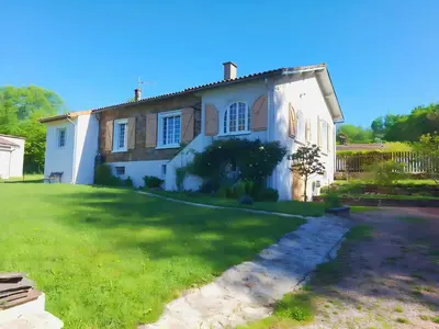 a dog house with a roof on a patio at Villa in St Denis with Pool & Pyrenees View in Saint-Denis