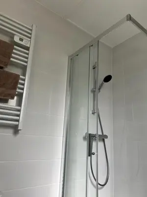 a shower with a glass door in a bathroom at Maisonnette Proche Gare & Centre l Jardin l Clim in Castres