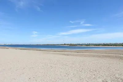 a beach with the ocean in the background at Proche plage du Grazel, Pavillon avec piscine - GN530-008 in Gruissan