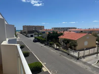 a view of a street from a balcony of a house at T2 traversant, 2 balcons, 4 pers, proche plage in Port-la-Nouvelle