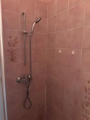 a shower with a shower head in a bathroom at T2 traversant, 2 balcons, 4 pers, proche plage in Port-la-Nouvelle