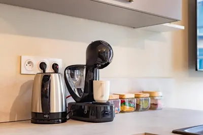 a coffee maker sitting on a kitchen counter at Plein centre - climatisé - à proximité cité médiévale in Carcassonne