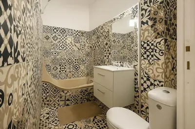 a bathroom with a toilet and a sink at Appartement rénové avec 2 chambres et espace bien-être Lavelanet in Lavelanet