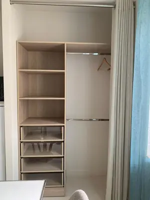 a closet with a white refrigerator with its door open at Nusa in Narbonne