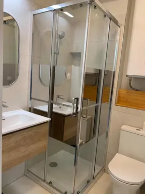 a bathroom with a shower and a toilet and a sink at Nusa in Narbonne