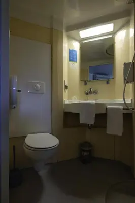 a bathroom with a toilet and a sink at Rocade capsule bungalow in Pamiers