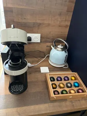a coffee maker and a box of chocolates at Appartement Moderne au centre de NARBONNE in Narbonne