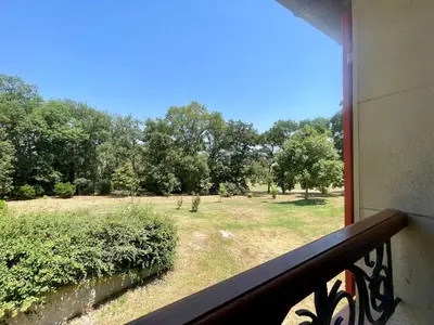 a balcony with a view of a field of trees at Le Gîte de Barrau in Fenouillet-du-Razès
