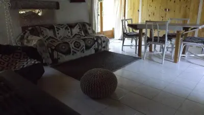 a living room with a couch and a table at Gîte mas Jourdane en Haut Languedoc in Anglès