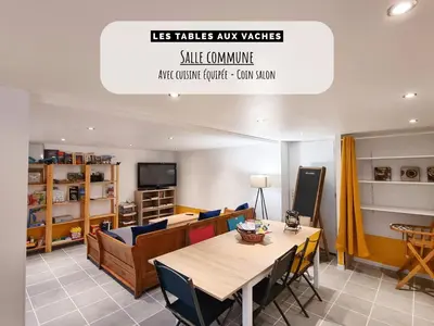 a dining room with a table and chairs at Les Tables Aux Vaches à la Salvetat in La Salvetat