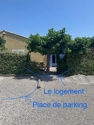 a tree with a blue rope in front of a building at Suite Bleuet in Peyriac-de-Mer