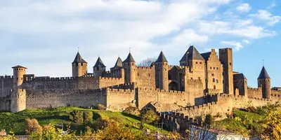 a large castle sitting on top of a hill at Charmante maison de village in La Digne-dʼAmont