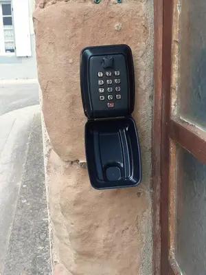 a black remote control on the side of a door at Charmante maison de village in La Digne-dʼAmont