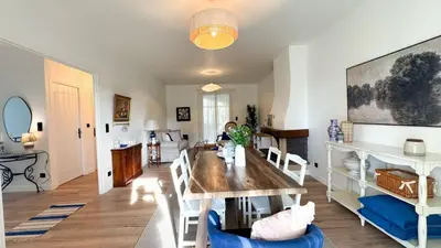 a dining room with a table and chairs at Maison Climatisée 5min Cité Terrasse et Parking AK in Carcassonne