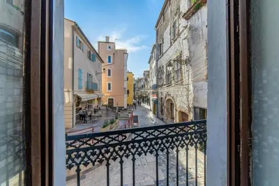 a view of a city street from a balcony at Elegant 2 bedrooms flat - 8mn walk from trainstation in Narbonne