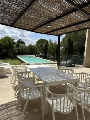 a dining room with a white table and chairs at Panorama by maison bacou in Carcassonne